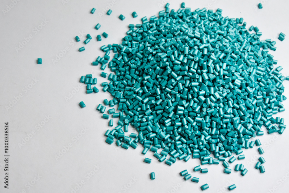 pearl turquoise masterbatch granules on a white background, this polymer is a product coloring agent in the plastics industry pearl turquoise masterbatch granules on a white background, this polymer is a product coloring agent in the plastics industry