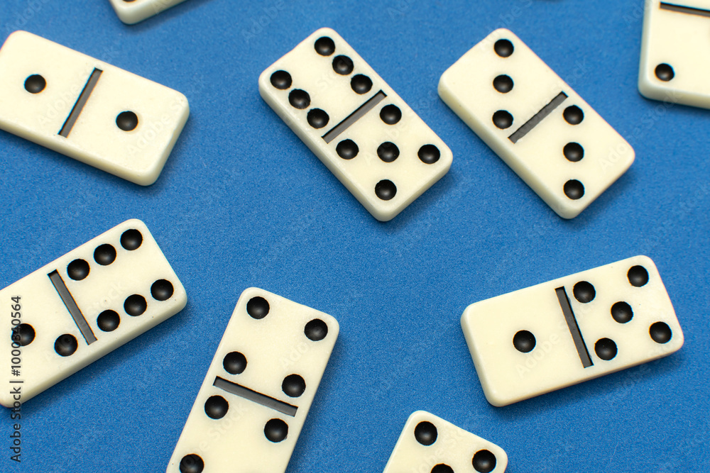 Dominoes bones on blue background Dominoes bones on blue background