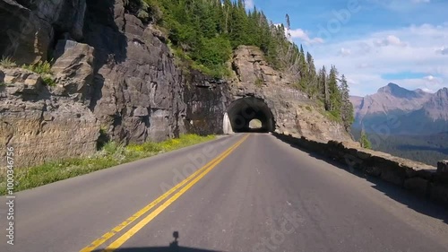 Driving through east tunnel on Going To The Sun Road in Glacier National Park, Montana, USA