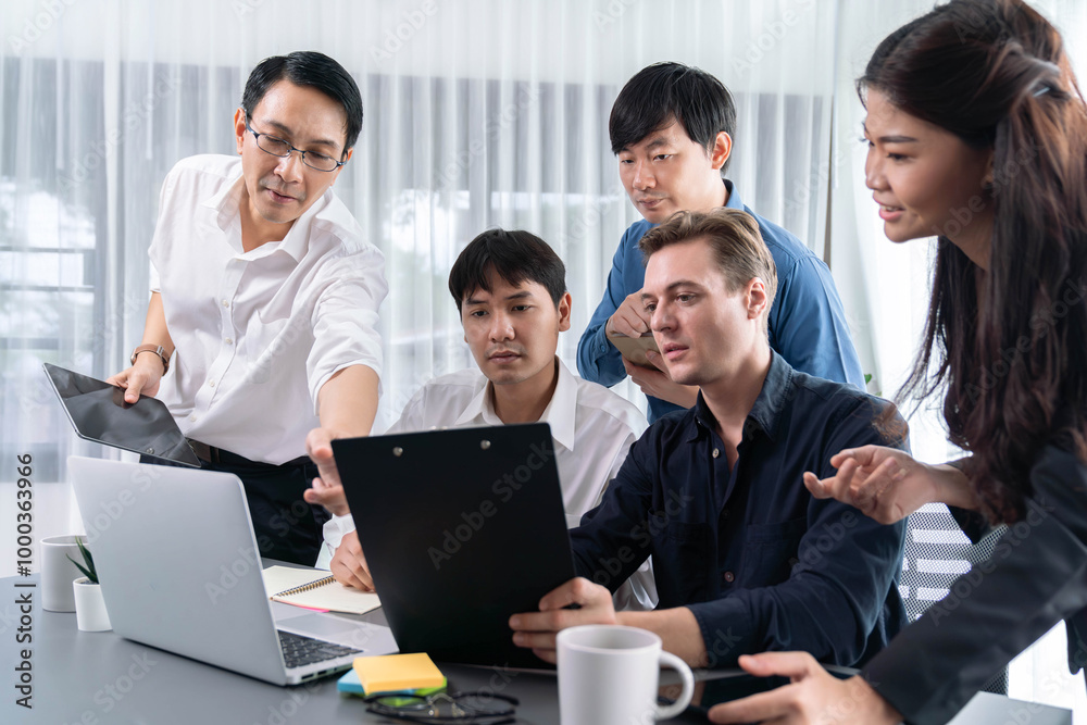 Group of diverse office worker employee working together on strategic business marketing planning in corporate office room. Positive teamwork in business workplace concept. Prudent Group of diverse office worker employee working together on strategic business marketing planning in corporate office room. Positive teamwork in business workplace concept. Prudent