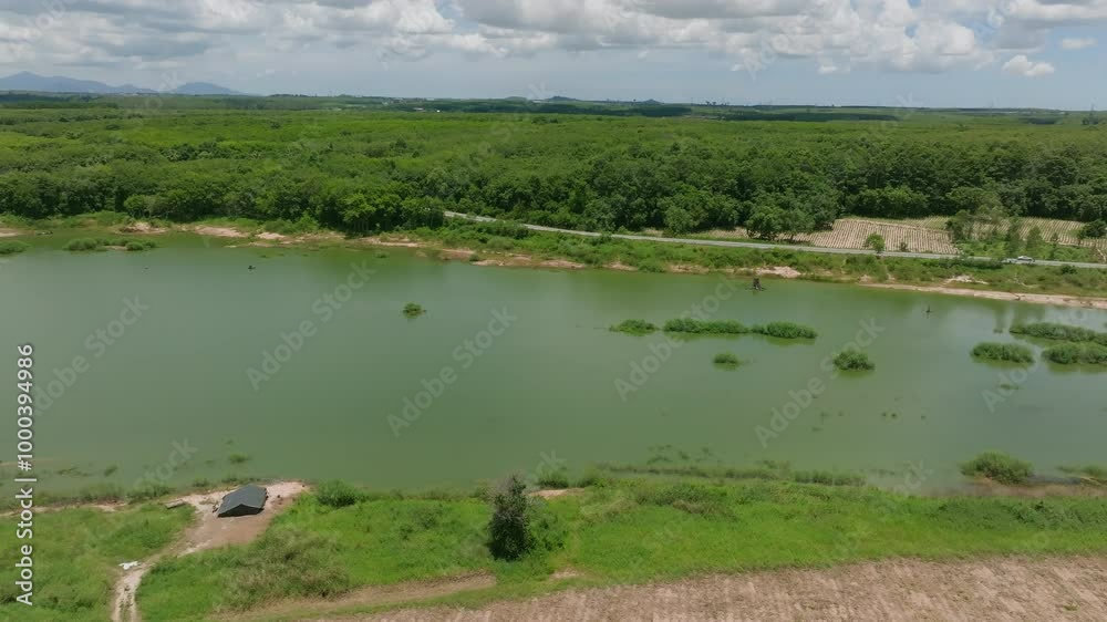 Exploring the Tranquil Landscape of the Riverbank Surrounded by Lush Greenery and Scenic Hills on a Sunny Afternoon Exploring the Tranquil Landscape of the Riverbank Surrounded by Lush Greenery and Scenic Hills on a Sunny Afternoon