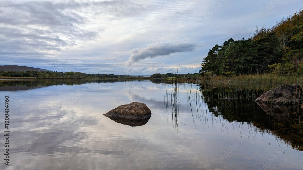 Beautiful lakeside landscape scenery with mirror reflection in Ross lake at Rosccahill, Galway, Ireland