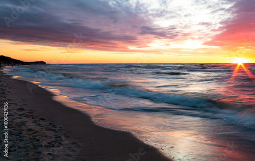 beautiful sunset over the Baltic Sea in the city, Pogorzelica, Poland.