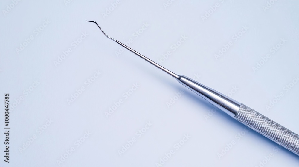 Naklejka premium Dental explorer tool on blue background