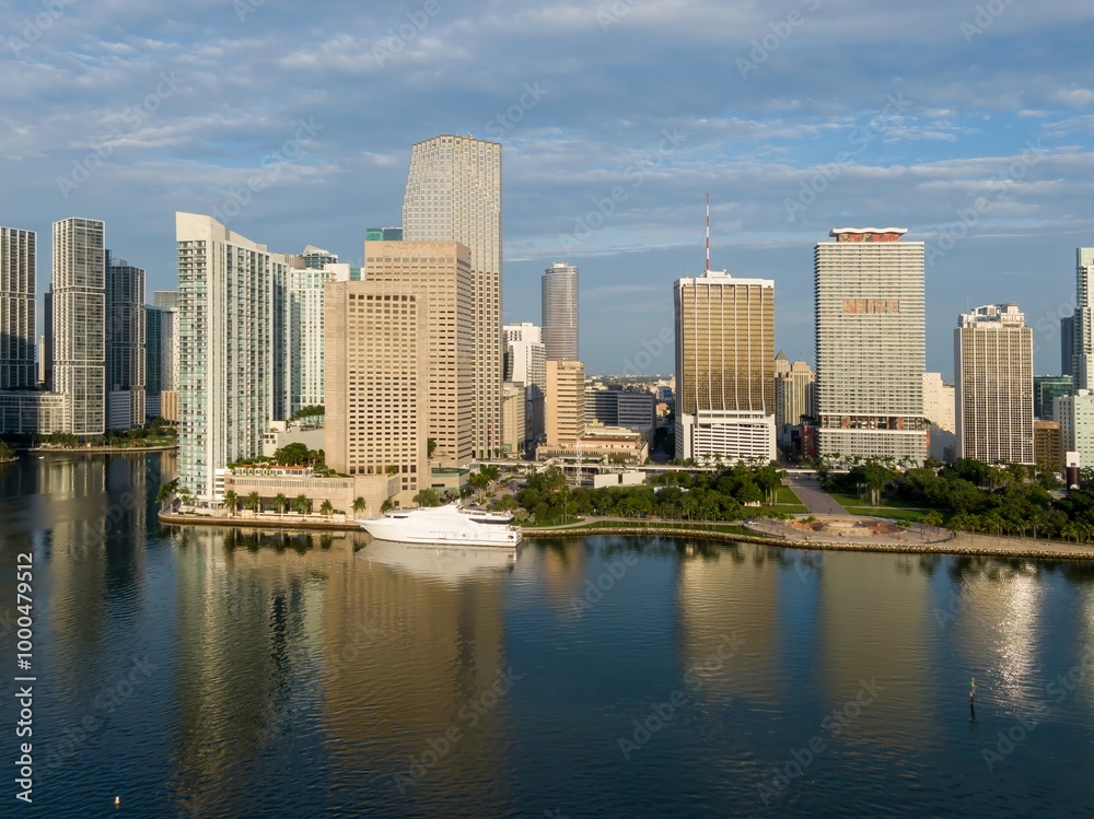 Downtown city skyline and calm ocean waterfront of Miami at sunrise, Florida, United States. Downtown city skyline and calm ocean waterfront of Miami at sunrise, Florida, United States.