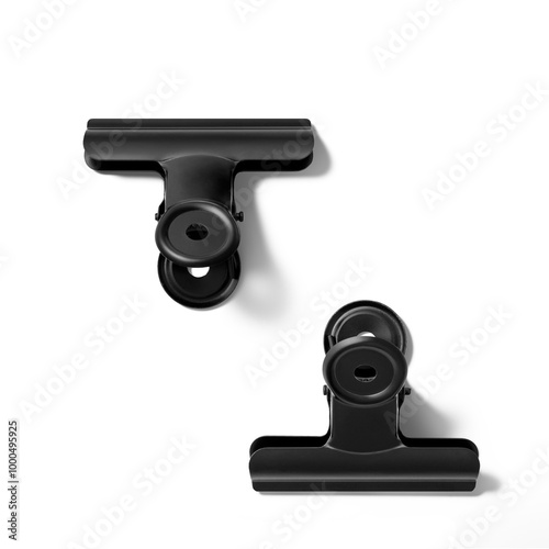 Black color paper binder clip or bulldog clip isolated on a transparent background, PNG. High resolution