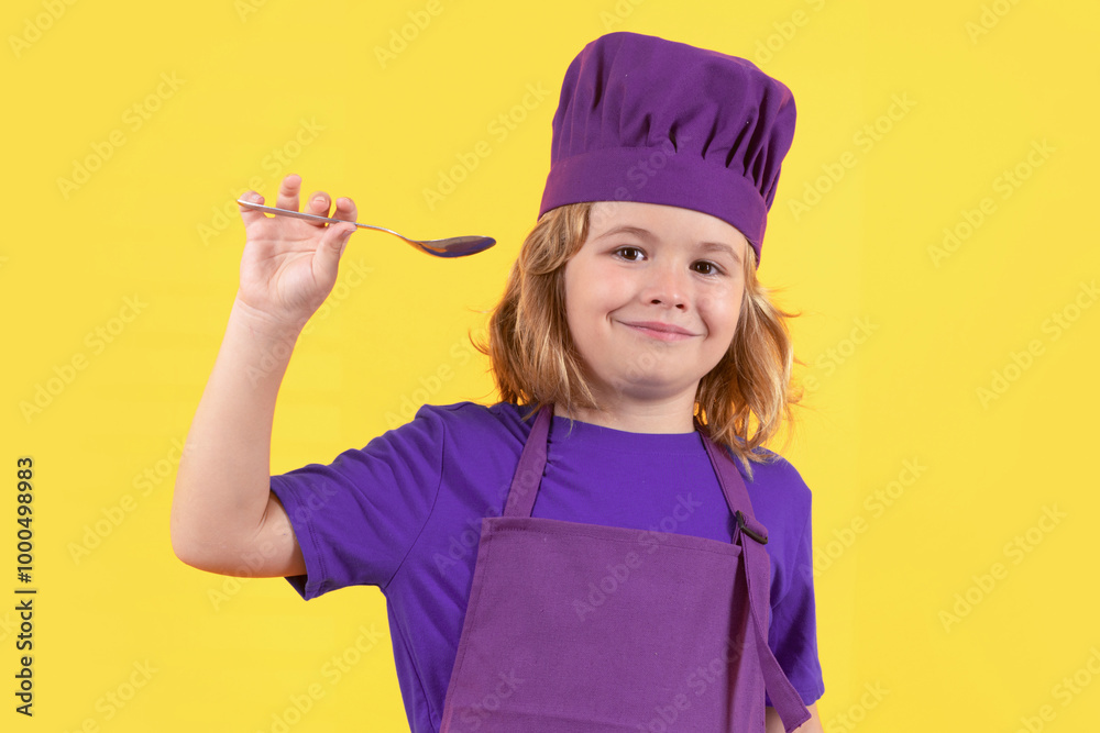 Funny kid chef cook with spoon, studio portrait. Kid chef cook, studio portrait. Children cooking. Kid boy with apron and chef hat. Funny kid chef cook with spoon, studio portrait. Kid chef cook, studio portrait. Children cooking. Kid boy with apron and chef hat.