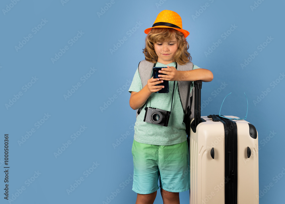Child traveler with travel bag in studio. Kids tourism. Child traveler with travel bag in studio. Kids tourism.