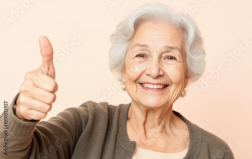 Friendly Elderly Woman Smiling and Showing Approval