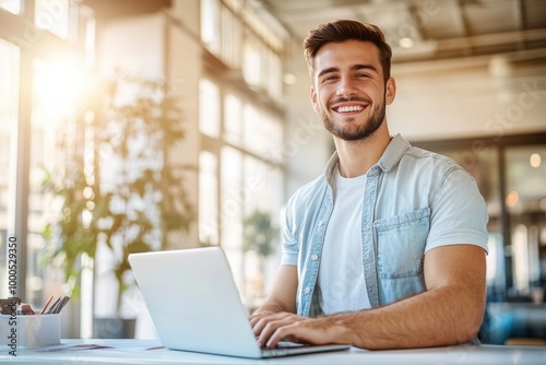 High-resolution brightly lit photorealistic candid photograph of a young marketer in casual attire, smiling while working on his laptop in a bright office. The photograph is styled like a high-end