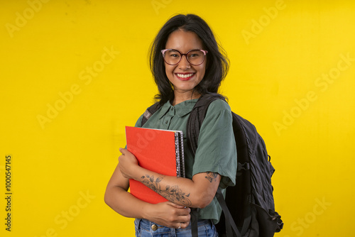Photography Woman, young, student with backpack and notebooks in hand in studio photography