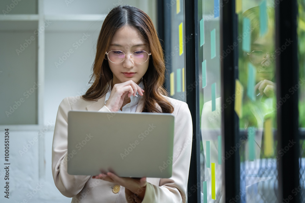 Happy Asian woman working in office Happy Asian woman working in office