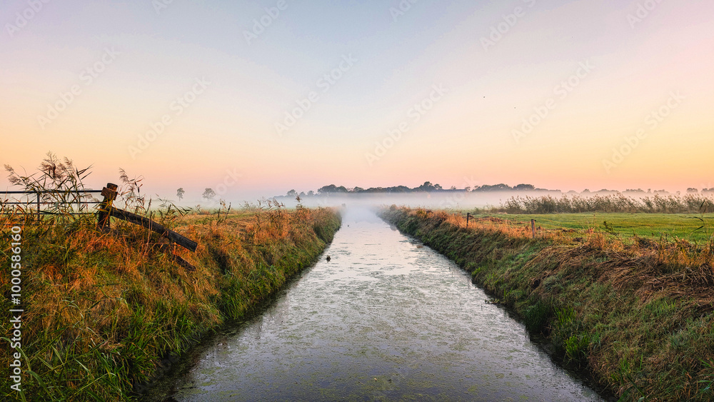 Small canal in the fog