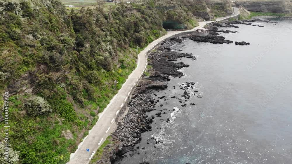 Jeju coast line road with cliff and sea Jeju coast line road with cliff and sea