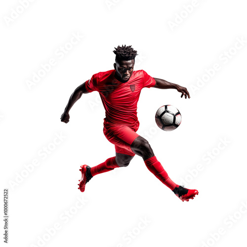 Dynamic soccer player in red uniform kicking a soccer ball against a white background, showcasing athleticism and intense focus.