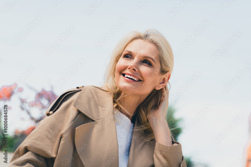 Portrait of attractive senior dreamy female resting strolling enjoy weekend touch hair feminine wear beige coat pastime fresh air outdoor Portrait of attractive senior dreamy female resting strolling enjoy weekend touch hair feminine wear beige coat pastime fresh air outdoor