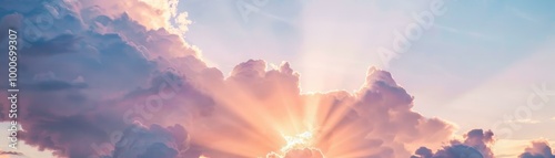Cinematic clouds with radiant sunlight beams, serene sky.