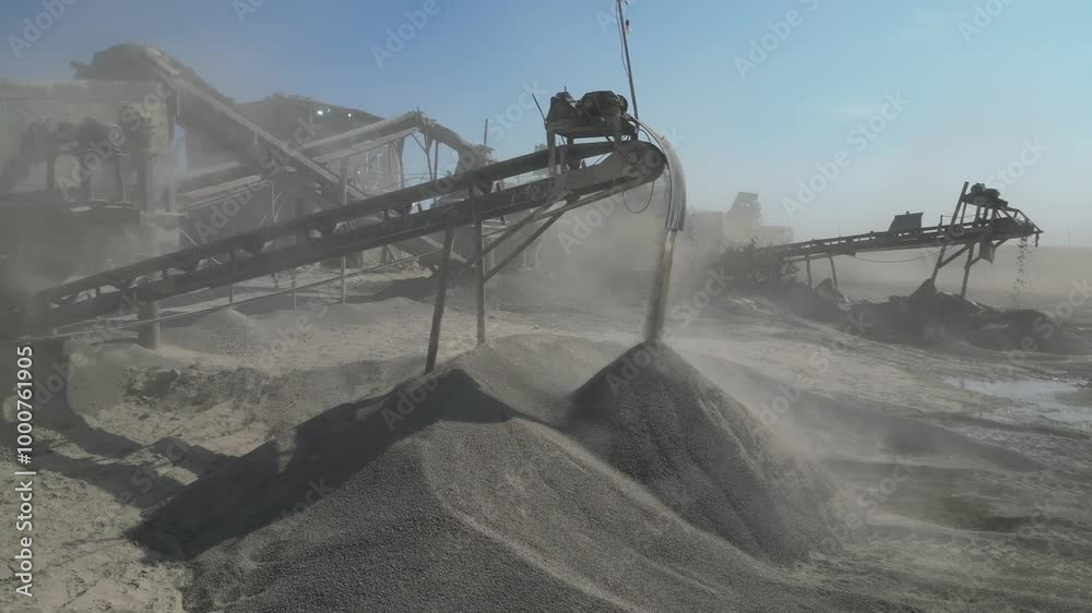 Gravel crushing line. Mechanized process of crushing rock into gravel. Aerial View