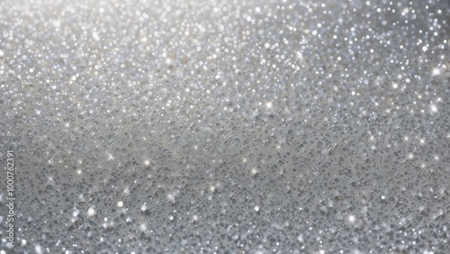 Glittery snow background, shimmering silver glitter over a soft white snow-like texture, sparkling and festive