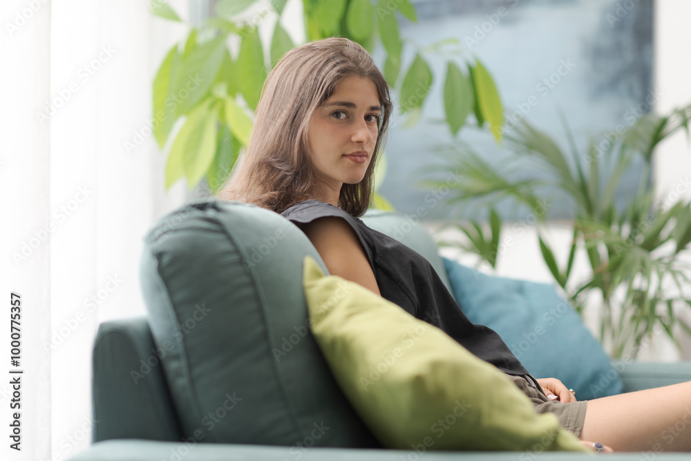 Cute young woman relaxing on the couch