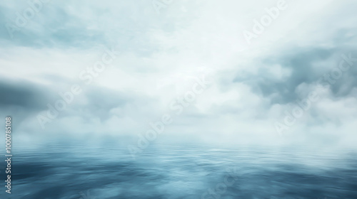 photo of a serene dark lake with a pale blue color under the cloudy sky