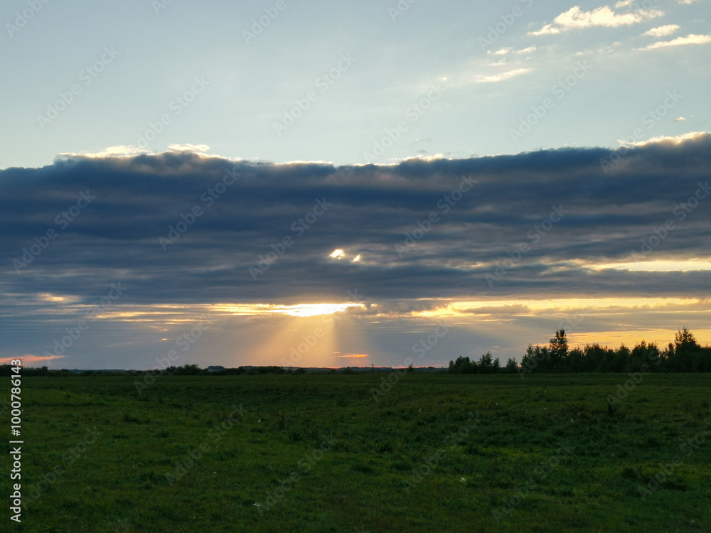 Field with a large cloud in the sky Field with a large cloud in the sky