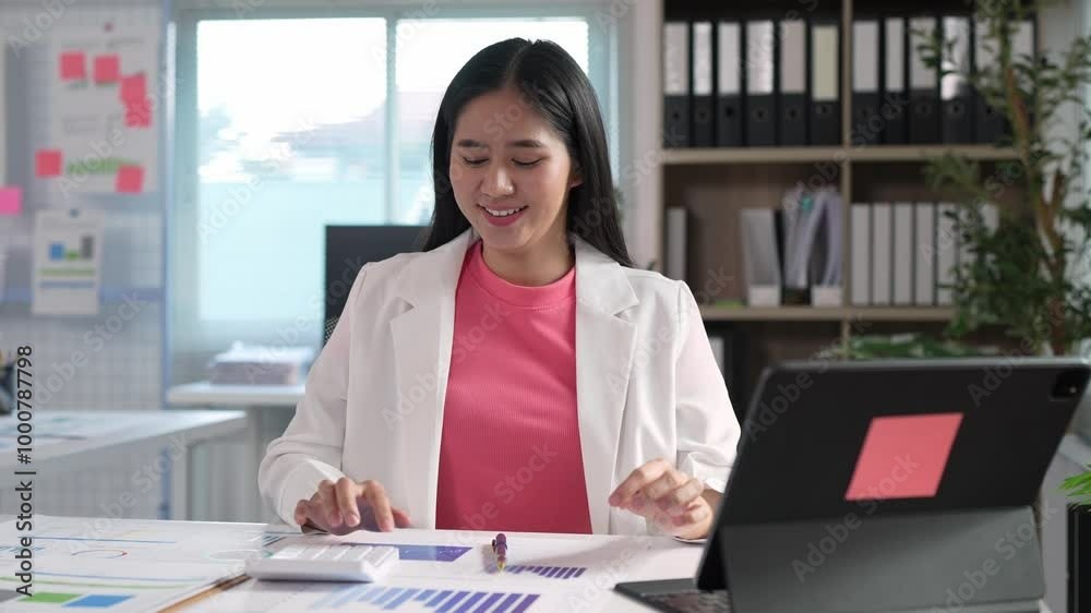 Attractive Asian businesswoman working on laptop in modern office. Finance expert, analyzing business reports, graphs, financial charts, economy, calculations, online marketing research. Attractive Asian businesswoman working on laptop in modern office. Finance expert, analyzing business reports, graphs, financial charts, economy, calculations, online marketing research.