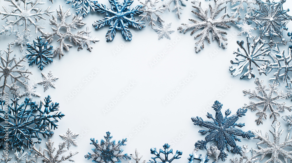 Glittery Blue and Silver Snowflakes Border on Light Background with Copy Space Glittery Blue and Silver Snowflakes Border on Light Background with Copy Space