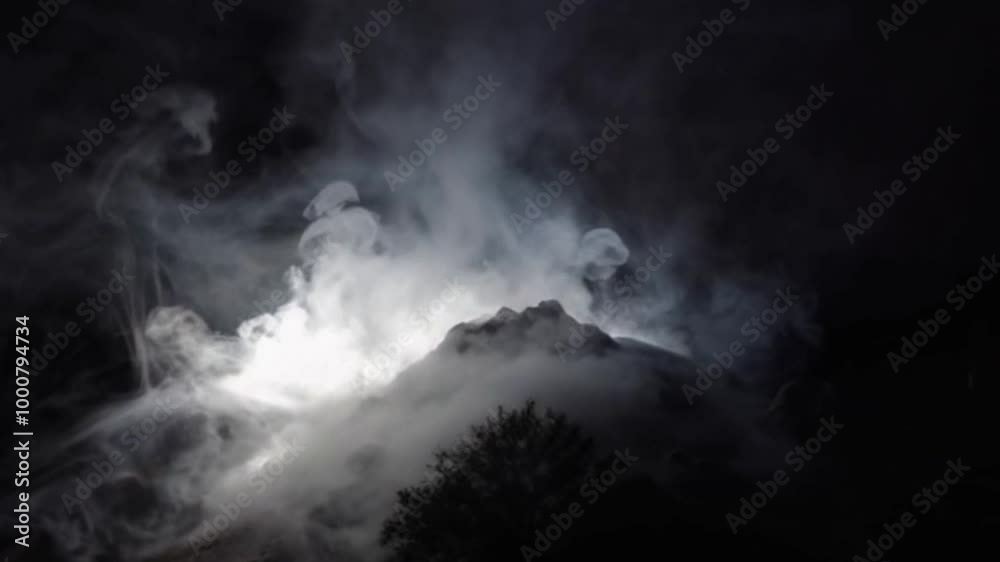 Thin mist moving slowly upwards with dramatic backlighting to highlight the soft texture and transparency of the smoke Thin mist moving slowly upwards with dramatic backlighting to highlight the soft texture and transparency of the smoke