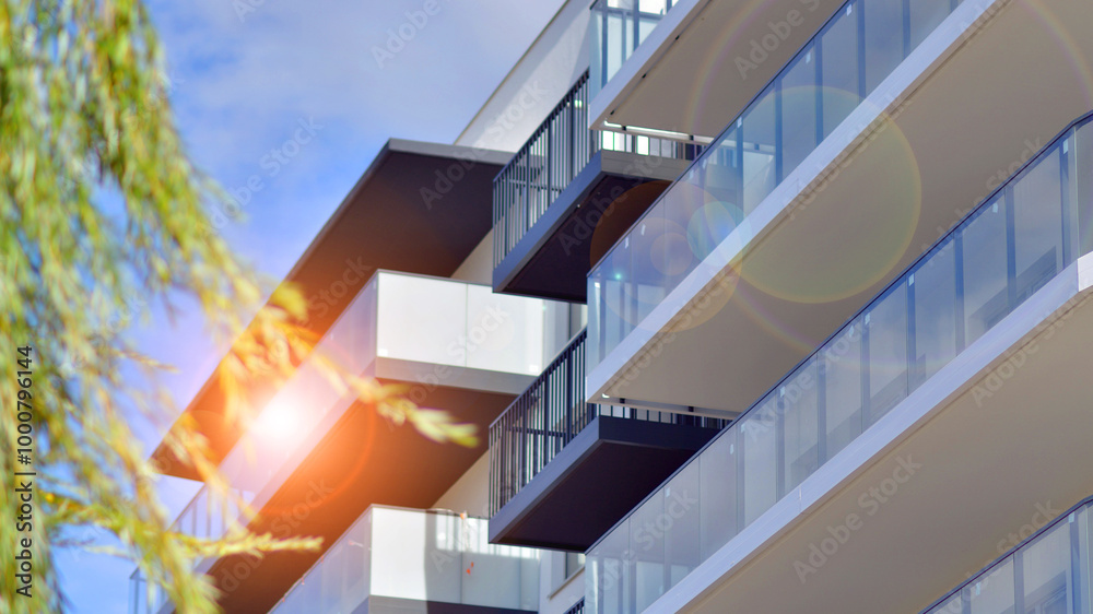 Fototapeta premium Modern architecture of urban residential apartment buildings on a sunny day. Facade of a modern apartment building.