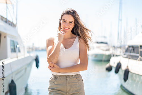 Young pretty woman at outdoors . Portrait