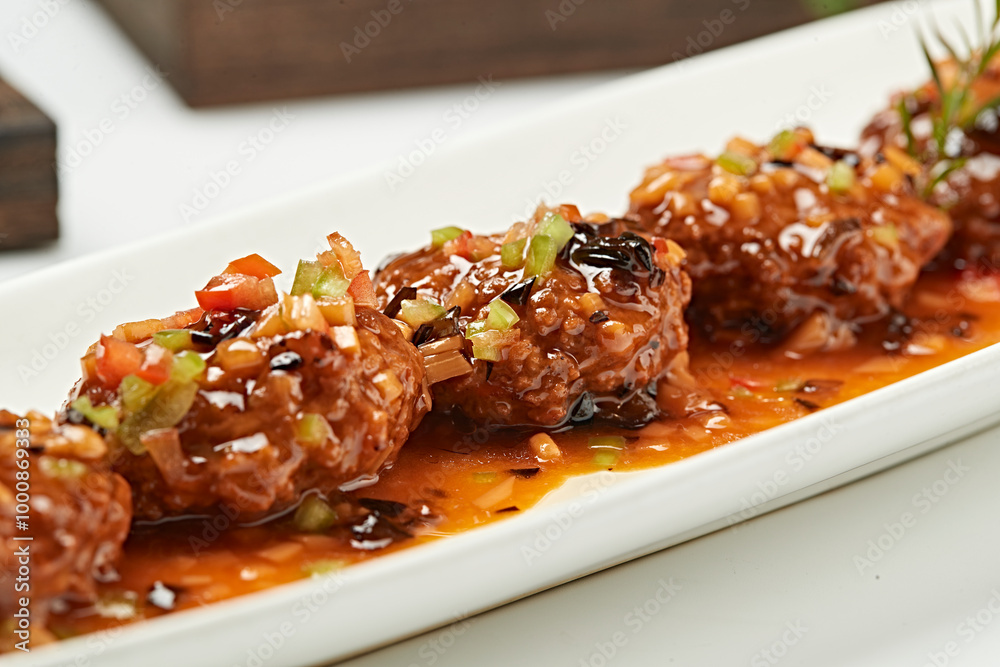 Pour the sauce over the fried meatballs Pour the sauce over the fried meatballs