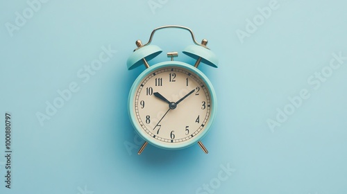 A blue alarm clock on a blue background.