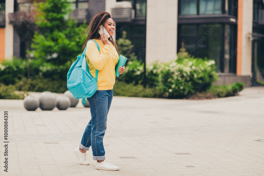 Photo of charming cute girl wear yellow sweatshirt clothes going home after lecture lesson september day outdoors Photo of charming cute girl wear yellow sweatshirt clothes going home after lecture lesson september day outdoors