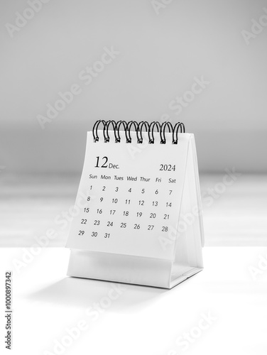 December 2024 page of small desk calendar for plan and reminder isolated on white background, vertical style. Simple planner 12th month, for business agenda and schedule concept.