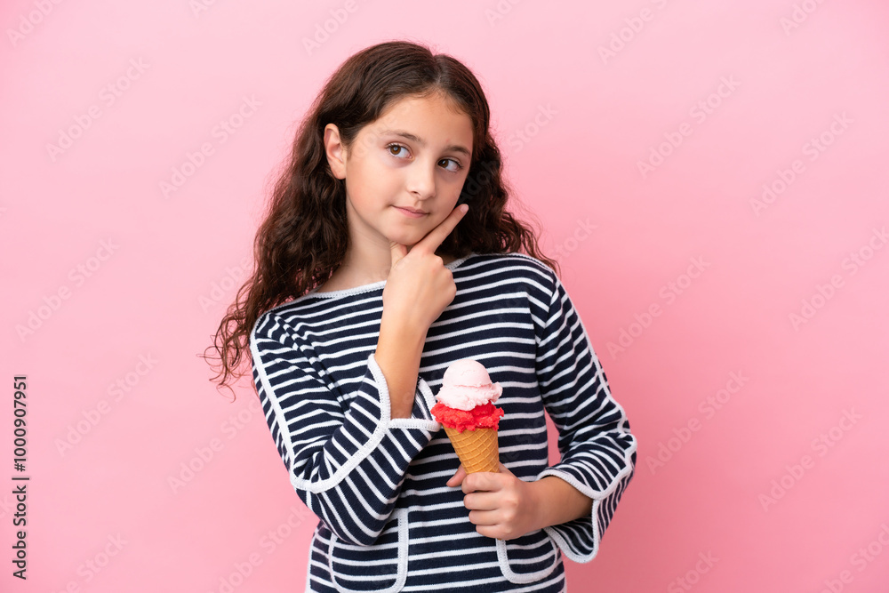 Little caucasian girl holding an ice cream isolated on pink background having doubts Little caucasian girl holding an ice cream isolated on pink background having doubts