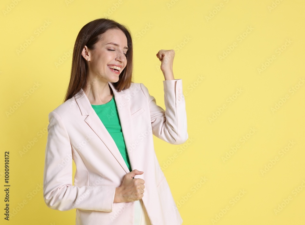 Happy winner on yellow background, space for text Happy winner on yellow background, space for text