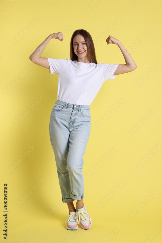 Portrait of happy winner on yellow background Portrait of happy winner on yellow background