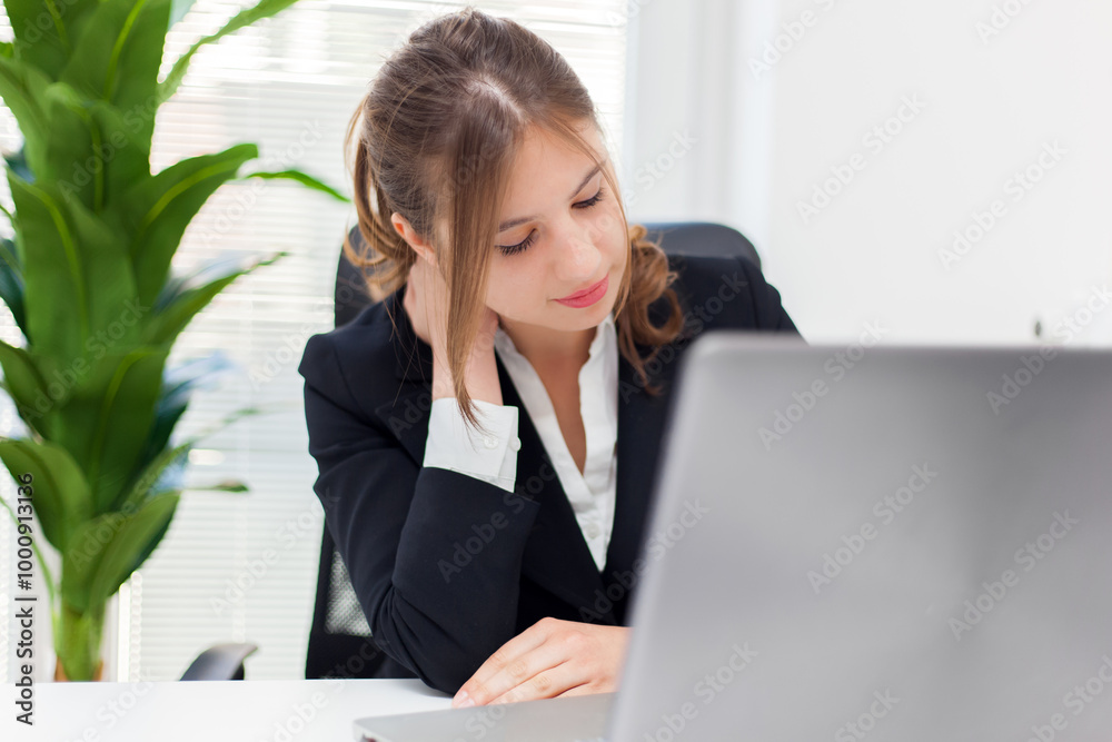 Professional woman working on laptop in office Professional woman working on laptop in office