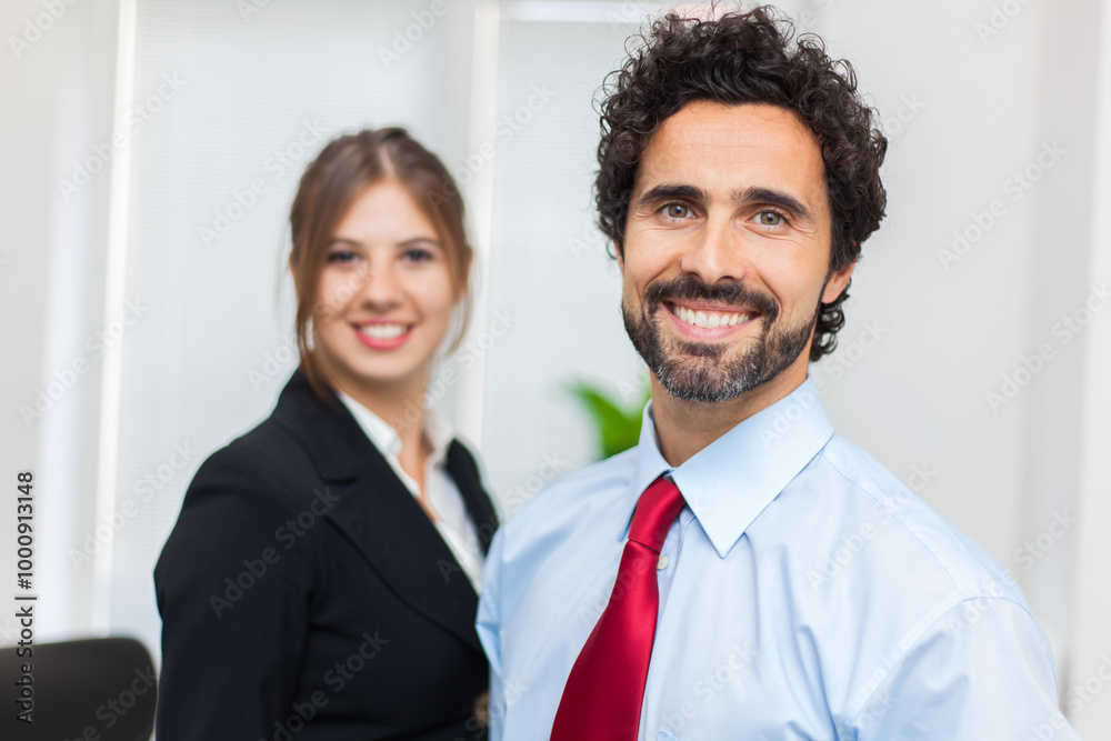 Professional team smiling in office environment Professional team smiling in office environment