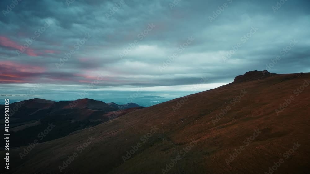 Aerial view over a mountain at the end of the day, sky threatening a storm is coming, Auvergne, Puy Mary an extinct volcano. Aerial view over a mountain at the end of the day, sky threatening a storm is coming, Auvergne, Puy Mary an extinct volcano.