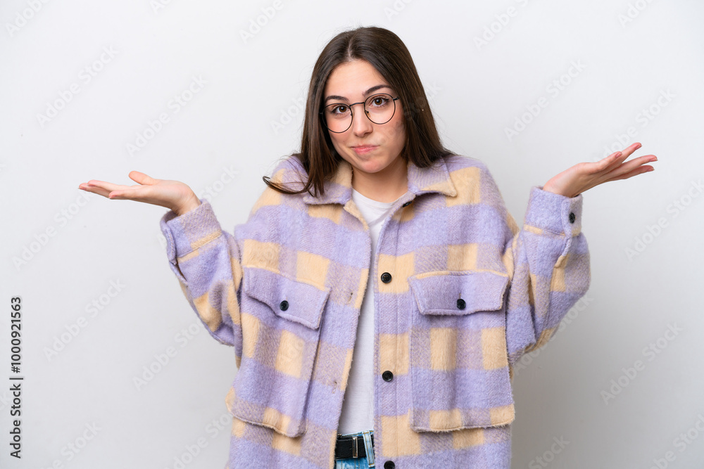 Young girl isolated on white background having doubts while raising hands Young girl isolated on white background having doubts while raising hands