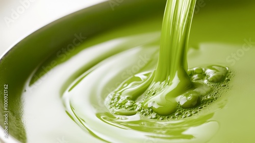 Wallpaper Mural A Stream of Lush Green Liquid Pouring into a Bowl, Captured with High-Speed Photography, Creating a Whirl of Green, Creamy Texture Torontodigital.ca