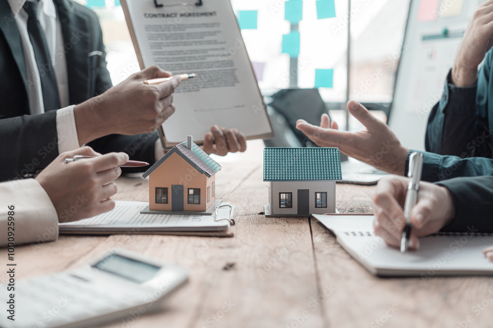 Real estate agent shows a sample home to a client after signing a contract with an approved loan application. Negotiating real estate details.