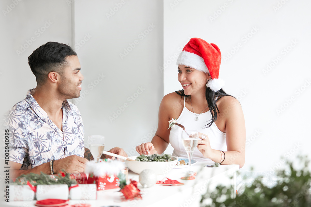 Young couple celebrating Xmas lunch together Young couple celebrating Xmas lunch together