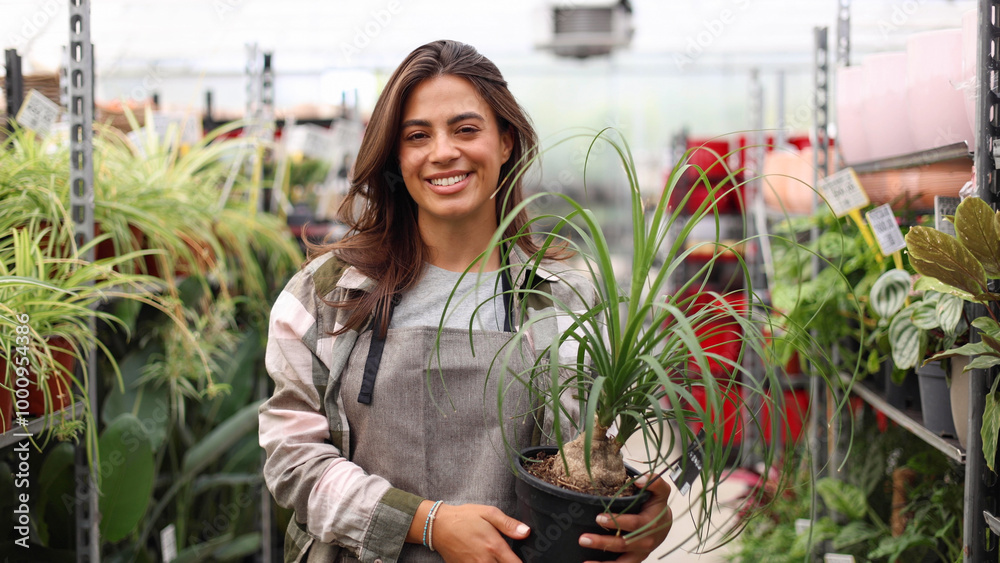Portrait of a female gardener enjoying among her plants Portrait of a female gardener enjoying among her plants