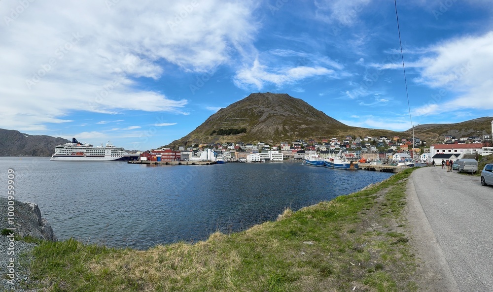 Honningsvåg, Nordkapp Municipality, Finnmark, Norway - lovely panorama fjord town and cruise port with ship on a sunny day Honningsvåg, Nordkapp Municipality, Finnmark, Norway - lovely panorama fjord town and cruise port with ship on a sunny day