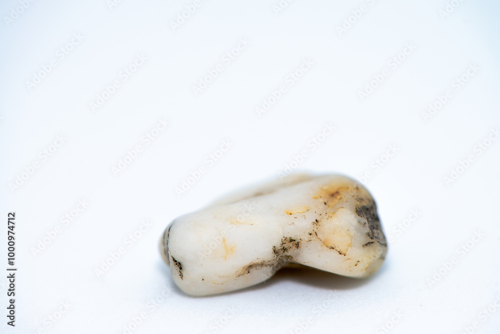 Macro Photo of Pebble Stones on White Background Macro Photo of Pebble Stones on White Background