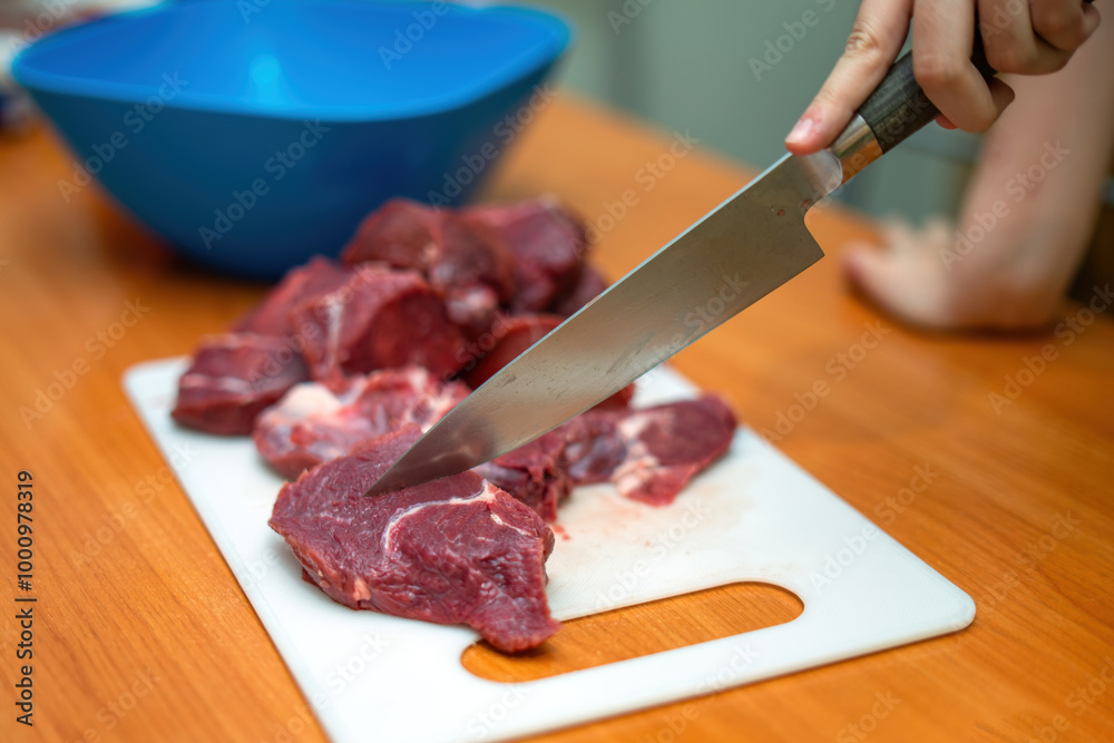 sharp knife glides effortlessly through tender beef fillet on a rustic home table, evoking the warmth of culinary creation and the art of cooking at home sharp knife glides effortlessly through tender beef fillet on a rustic home table, evoking the warmth of culinary creation and the art of cooking at home