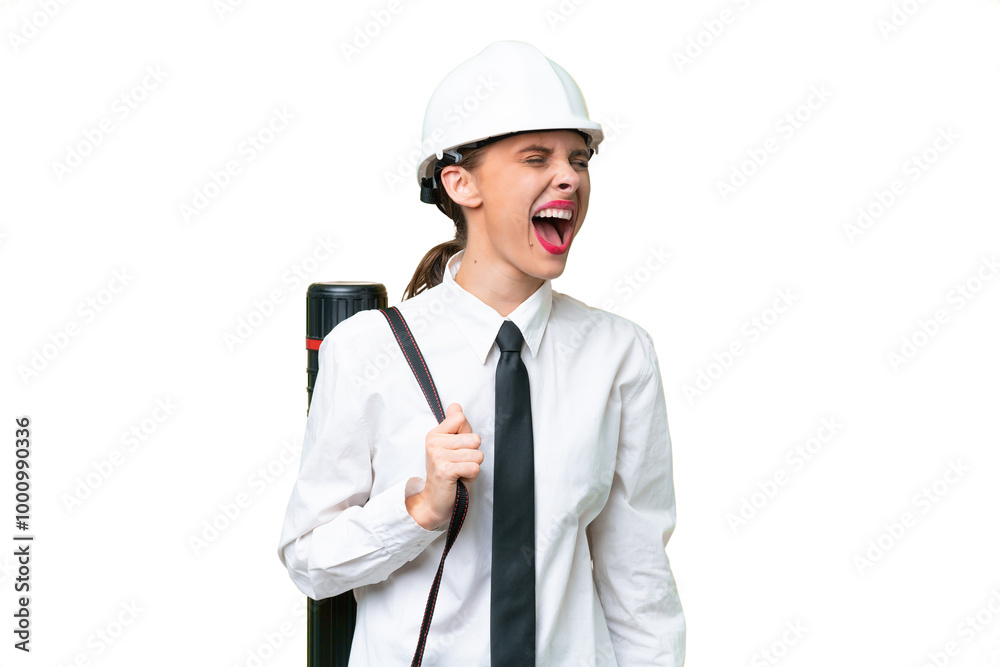 Young architect woman with helmet and holding blueprints over isolated background laughing in lateral position Young architect woman with helmet and holding blueprints over isolated background laughing in lateral position